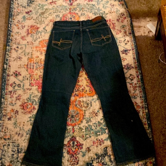 dark blue low rise jeans. They really show off curves and are very comfortable. - Picture 2 of 4